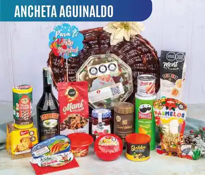 Ancheta navideña Aguinaldo de $385.000 con crema de whisky Baileys de 750 ml, arenque Rugen Fisch, queso Alpina y panettone en canasta de mimbre