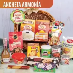 Ancheta navideña Armonía de $130.000 con espumoso JP Chenet, panettone Bauducco, natilla y buñuelos en cesta artesanal de mimbre