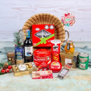 Ancheta navideña de $320.000 con Ferrero Rocher, vino Gato Negro Merlot, torta Ramo Felicidades, obleas Alquería y Pringles en canasta de junco