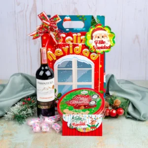 Ancheta navideña para pareja de $84.000 con vino Frontera Carmenere, galletas Merry Christmas Greco en lata y masmelos, en caja Feliz Navidad
