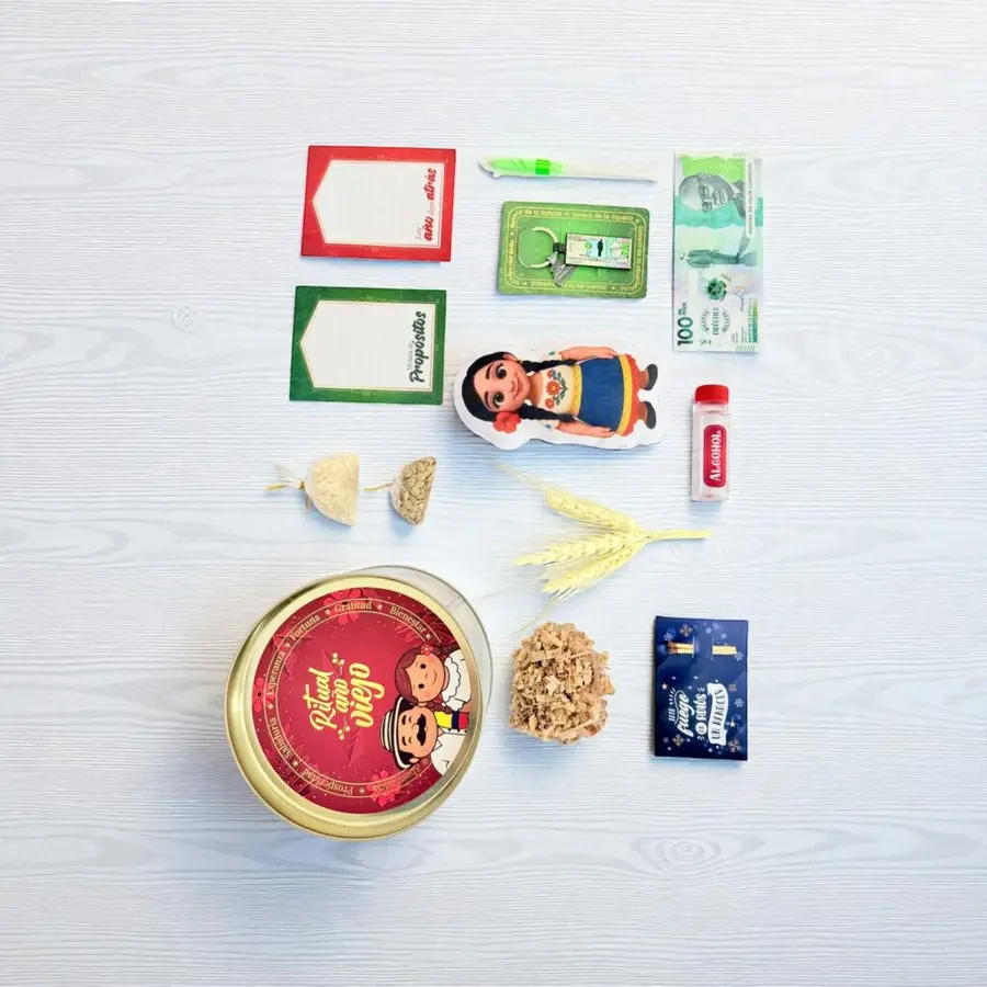 Kit del muñeco de año viejo desplegado con la lata, las tarjetas, el billete y las espigas